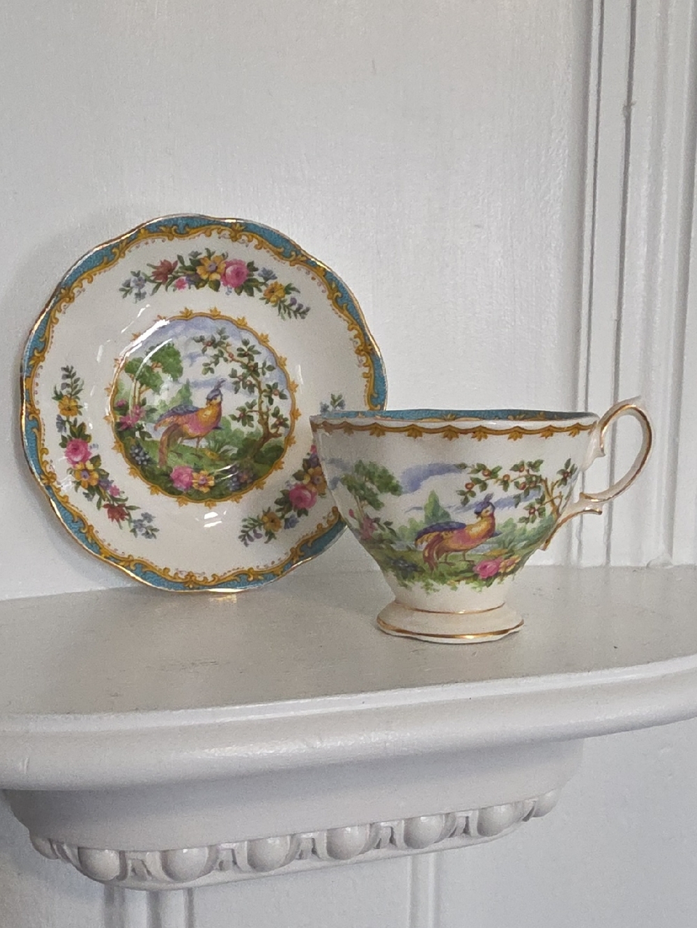 vintage Royal Albert teacup and saucer set is in the "Chelsea Bird" pattern